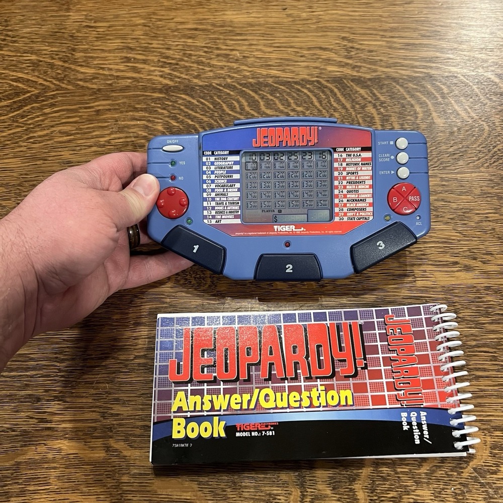 Tiger Electronics Jeopardy Hand Held Game With Cartridge & Answer Question Book